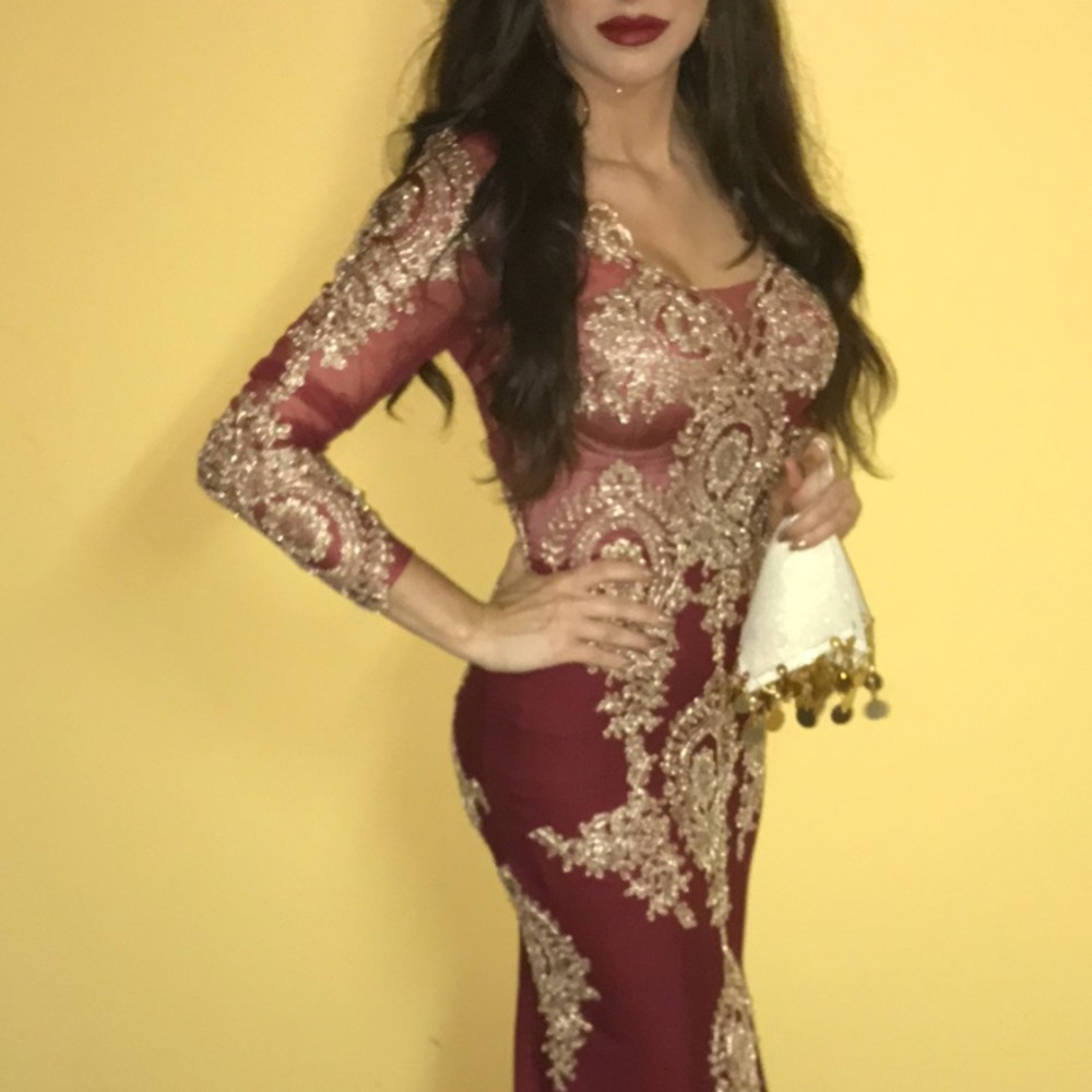 Red gown with gold detailing.